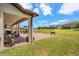 Backyard featuring a patio with furniture and a view of the lake and neighborhood at 163 Rosa Bella Vw, Debary, FL 32713