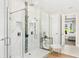 Modern bathroom with glass enclosed shower and mosaic tile accent at 163 Rosa Bella Vw, Debary, FL 32713