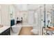 Bright bathroom featuring a soaking tub, glass shower, and double vanity sinks at 163 Rosa Bella Vw, Debary, FL 32713