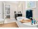 Bright bathroom with a luxurious soaking tub and view to an adjacent bedroom at 163 Rosa Bella Vw, Debary, FL 32713