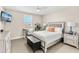Bedroom featuring a bed, stylish furniture, and ample natural light at 163 Rosa Bella Vw, Debary, FL 32713