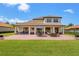 Spacious backyard with a brick patio, offering plenty of room for outdoor activities and relaxation at 163 Rosa Bella Vw, Debary, FL 32713