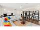 Open living room featuring hardwood floors, sectional sofa, and modern decor at 163 Rosa Bella Vw, Debary, FL 32713