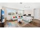 Bright living room with hardwood floors, comfortable seating, and natural light at 163 Rosa Bella Vw, Debary, FL 32713