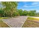 Paved brick parking area with well maintained landscaping and manicured hedges at 163 Rosa Bella Vw, Debary, FL 32713