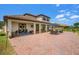 Exterior patio with brick flooring, outdoor furniture, and a grill at 163 Rosa Bella Vw, Debary, FL 32713