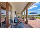 Covered patio with brick flooring, outdoor furniture, and a view of the water at 163 Rosa Bella Vw, Debary, FL 32713