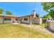 Large backyard with a well-kept lawn, above-ground pool, and a cozy patio area with outdoor seating at 1650 Jacobs Rd, South Daytona, FL 32119