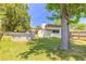Serene backyard featuring an above-ground pool, lush lawn, mature trees, and a fenced perimeter for privacy at 1650 Jacobs Rd, South Daytona, FL 32119