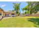 Expansive backyard features lush lawn, a patio set, and an above-ground pool, ideal for outdoor entertaining at 1650 Jacobs Rd, South Daytona, FL 32119