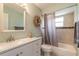 Bathroom showing neutral color palette, a single sink vanity and a shower-tub combination at 1650 Jacobs Rd, South Daytona, FL 32119