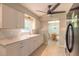 Bright kitchen features white cabinetry, modern fixtures and an inviting atmosphere at 1650 Jacobs Rd, South Daytona, FL 32119