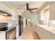 Well-equipped kitchen with modern appliances, white cabinetry, and tile flooring at 1650 Jacobs Rd, South Daytona, FL 32119