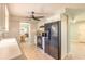 Well-lit kitchen with white cabinets, modern appliances, and neutral color palette at 1650 Jacobs Rd, South Daytona, FL 32119