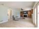 Living room features tile flooring, fireplace, built in book shelves and an outdoor access door at 1650 Jacobs Rd, South Daytona, FL 32119