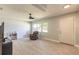 Bright living room showcasing neutral walls, tile floors, and comfortable recliner with natural light at 1650 Jacobs Rd, South Daytona, FL 32119