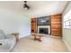 Cozy living room boasts a fireplace, built-in shelving, and neutral decor at 1650 Jacobs Rd, South Daytona, FL 32119