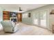 Bright living room featuring tile floors, fireplace, and built-in shelving at 1650 Jacobs Rd, South Daytona, FL 32119