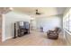 Spacious living room features tile flooring and a comfortable seating area with entertainment center at 1650 Jacobs Rd, South Daytona, FL 32119
