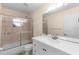 Bathroom featuring white vanity and shower with updated fixtures at 1715 Queen Palm Dr, Edgewater, FL 32132