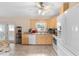 Bright kitchen with stainless steel appliances, wood cabinets, and a door to the outside at 1715 Queen Palm Dr, Edgewater, FL 32132