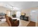 Cozy living room with tile flooring, comfortable seating, and natural light from front door at 1715 Queen Palm Dr, Edgewater, FL 32132