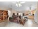 Inviting living area showcasing tile floors, comfortable seating, open layout with kitchen access at 1715 Queen Palm Dr, Edgewater, FL 32132
