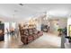 Open concept living space with tile flooring, comfortable seating, dining area, and kitchen at 1715 Queen Palm Dr, Edgewater, FL 32132