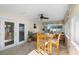 Bright sun room with tiled floors, ceiling fan, and lots of windows at 1715 Queen Palm Dr, Edgewater, FL 32132