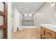 Spacious bathroom with a walk-in shower, modern vanity, and stylish tiles at 1841 Spruce Creek Blvd, Port Orange, FL 32128