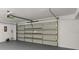 Spacious garage with an automated door system and painted floor at 1841 Spruce Creek Blvd, Port Orange, FL 32128