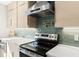 Modern kitchen showcases stylish countertops, stainless steel appliances, and updated backsplash at 1841 Spruce Creek Blvd, Port Orange, FL 32128