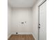 Compact laundry room with utility connections and a white door at 1841 Spruce Creek Blvd, Port Orange, FL 32128