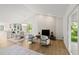 Open concept living room boasts vaulted ceilings, modern fireplace, and seamless transition to the kitchen at 1841 Spruce Creek Blvd, Port Orange, FL 32128