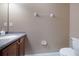 Neutral half bathroom featuring a granite vanity top and tile flooring at 1929 Cove Point Rd, Port Orange, FL 32128