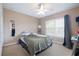 Bright bedroom has neutral colors, and lots of natural light at 1929 Cove Point Rd, Port Orange, FL 32128