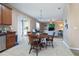 Dining room next to an open-concept kitchen and living area with plenty of natural light at 1929 Cove Point Rd, Port Orange, FL 32128
