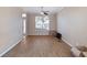 Empty living room with light walls, new vinyl floors, and lots of natural light at 1929 Cove Point Rd, Port Orange, FL 32128