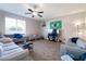 Comfortable living room with plenty of natural light, fan, and entertainment space at 1929 Cove Point Rd, Port Orange, FL 32128