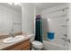 Well-lit bathroom features shower-tub combo, vanity with sink, and toilet for convenience at 1930 Harston Trl, The Villages, FL 32162