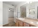 Clean bathroom featuring neutral paint, tile floors, and a connecting door to a bedroom at 1930 Harston Trl, The Villages, FL 32162