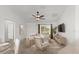 Comfortable living area with a view to the kitchen and front window at 1930 Harston Trl, The Villages, FL 32162
