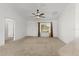 Open concept living space flowing into the kitchen and dining area at 1930 Harston Trl, The Villages, FL 32162