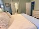 Bright and airy bedroom featuring access to ensuite bath and a large dresser at 201 Asterbrooke Dr, Deland, FL 32724