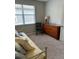 Bedroom featuring a daybed and dresser with wood finish at 201 Asterbrooke Dr, Deland, FL 32724