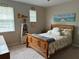 Bedroom featuring a plush bed, two windows, and decor throughout at 201 Asterbrooke Dr, Deland, FL 32724