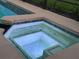 Relax in the bubbly hot tub with patterned tile; an oasis of relaxation awaits at 201 Asterbrooke Dr, Deland, FL 32724