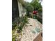 Close-up of beautiful, low-maintenance landscaping with decorative rocks, plants, and greenery at 201 Asterbrooke Dr, Deland, FL 32724