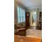 Cozy living room with hardwood floors and plenty of natural light at 201 Asterbrooke Dr, Deland, FL 32724