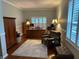 Comfortable home office featuring hardwood floors, chair, and built-in storage at 201 Asterbrooke Dr, Deland, FL 32724
